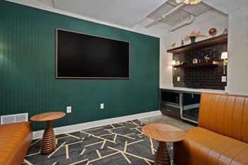 Media room with flat screen tv and leather sofas